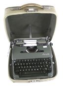 An Olympia De Luxe portable manual typewriter.