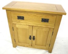 A contemporary JB Gobal bleached oak cupboard. With a single drawer and two doors below.