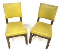 A pair of Arts and Crafts chairs.