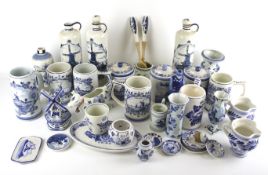 A collection of 20th century Delft blue and white china. Including a cow creamer, a windmill, etc.