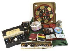 A collection of assorted vintage games. Including table bowls, African Cowries, etc.