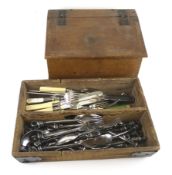 A vintage wooden hinged box and a collection of cutlery.