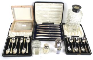 Two sets of six silver tea or coffee spoons and other items.