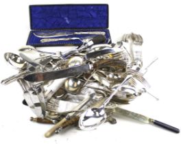 A collection of silver-plated flatware and serving items.