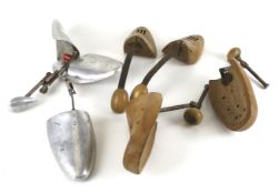 A collection of vintage shoe stretchers. Including a wooden example by The Shoe Co.