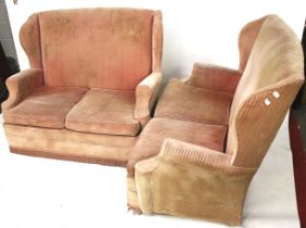 A pair of wingback sofas.