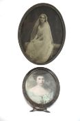A 'Sterling' oval photograph frame, and another plated.