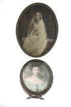 A 'Sterling' oval photograph frame, and another plated.