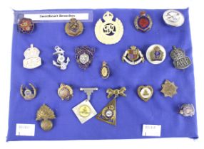 A collection of Sweetheart brooches.