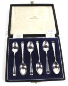 A set of six silver coffee spoons.