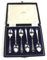 A set of six silver coffee spoons.