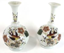 A pair of 20th century white glass vases.