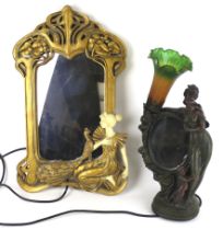 A contemporary Art Nouveau style lamp and mirror.