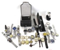 A collection of assorted vintage and modern designer wrist and bracelet watches.