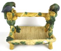 A Majolica basket decorated with parrots.