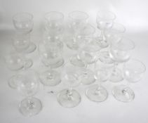 Sixteen Edwardian wine glasses. Of various sizes, all with the same etched decoration, Max.