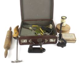 A small vintage suitcase and a group of assorted collectables.