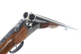 A Zobala 12 gauge side by side shotgun.