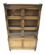 An oak minty glazed bookcase cupboard.