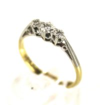 A vintage gold and diamond three stone ring.