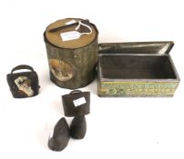 Two vintage biscuit tins and a set of miniature cow bells. Including Macfarlane, Lang & Co.