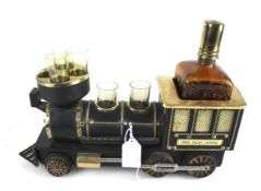 A novelty decanter and glasses set modelled as the locmotive '1880 Iron Horse'.