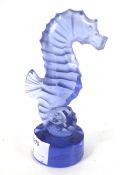 A Lalique blue glass seahorse.