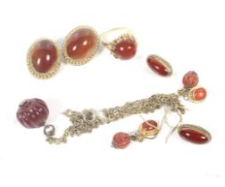 A collection of carnelian jewellery including a round cabochon single stone ring.