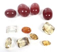 A small collection of loose semi-precious and other stones including citrine and amber