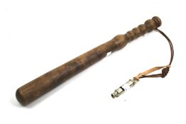 A wooden truncheon and a J Hudson & Co whistle.