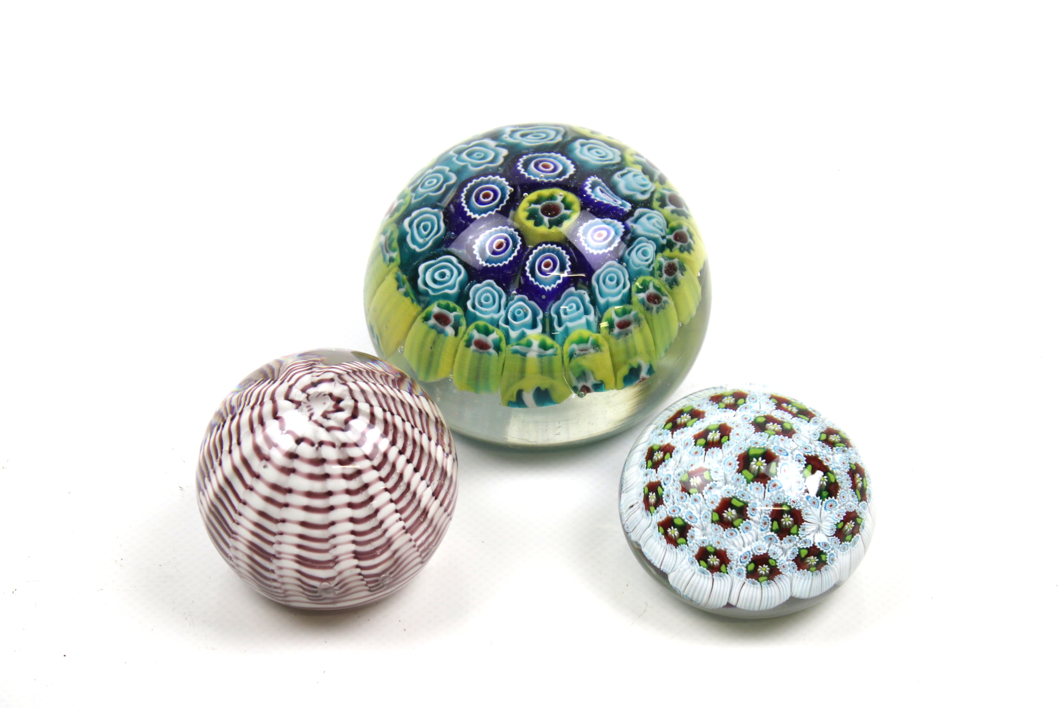 Three vintage glass paperweights. Two millefiori, all of assorted colours and sizes. Max.