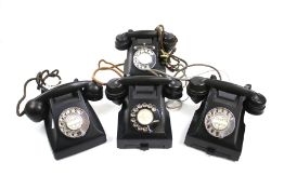 Four vintage telephones.