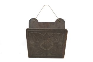 A circa 1900 country house oak letter holder. Carved in low relief with a flower motif.