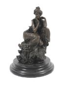 A patinated cast bronze sculpture of an Edwardian style lady.