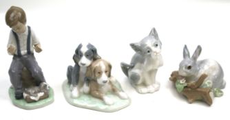 A collection of four Spanish porcelain figures.