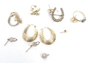 A small collection of 9ct gold and other jewellery including a pair of Italian fluted-hoop earrings.