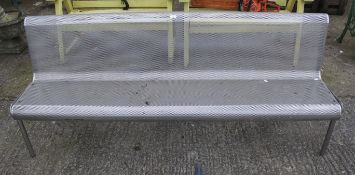 A contemporary metal bench.