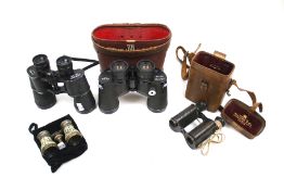 Collection of four assorted binoculars. Including a vintage pair of Dolland, etc.