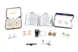 A mother of pearl dress set, various cufflinks, two metal hip flasks and other items.