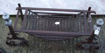 A wrought iron fire basket.