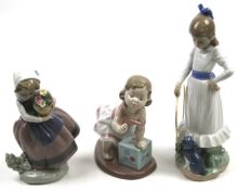 Two Lladro figures and a Nao figure.