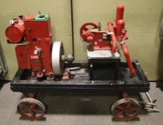 A vintage Lister 'D' stationary engine on a trolley. No. 1/55388 with a vintage Climax water pump.