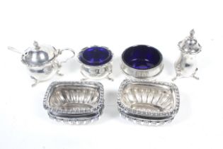 A collection of silver cruets.