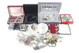 A collection of costume jewellery and five silver salt or mustard spoons.