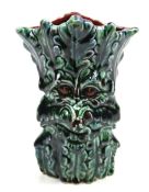An Anita Harris studio pottery 'Greenman' vase. Glazed in green and red, signed in gold to base.