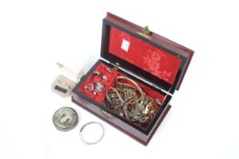 A collection of costume jewellery in a wooden box,