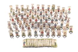 A quantity of card soldiers on metal stands from the 1930s boardgame L'Attaque