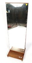A mid-century full length cheval mirror. Mounted on a wooden base.