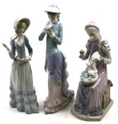 Three Lladro figures of ladies. All wearing historical attire, Max.