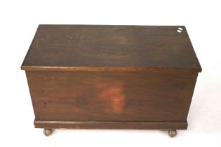 A vintage stained pine blanket box.